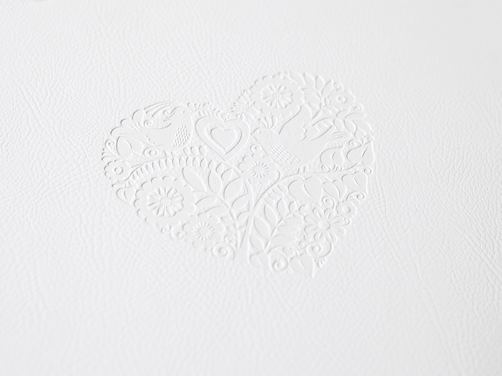 Debossed heart label embellishment