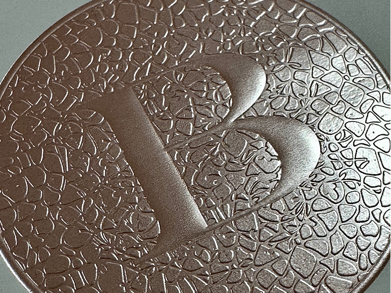Pale pink foil B high end label embellishment