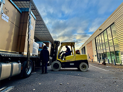 Forklift truck unloading HP Indigo 6K+ from lorry