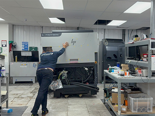 Pushing the new HP Indigo 6K+ in to place