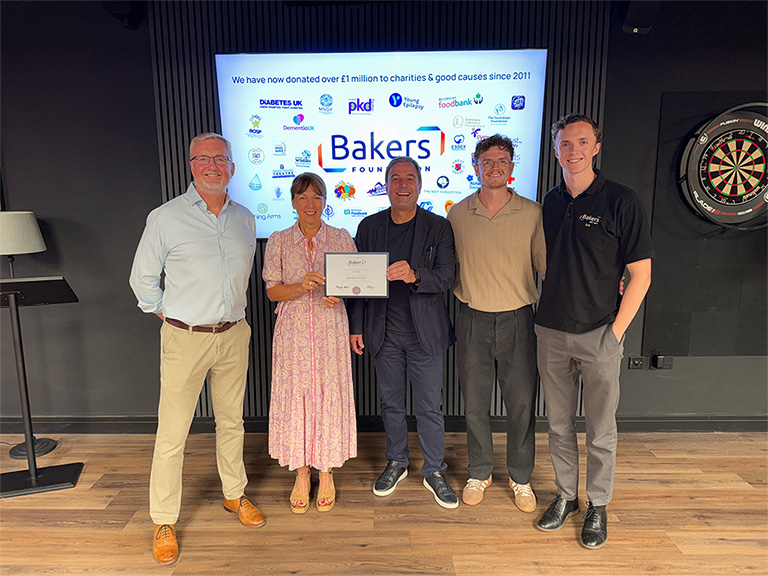 Gail and Jason O'Shea from Wipe Away Those Tears receive a donation from Bakers Foundatiion